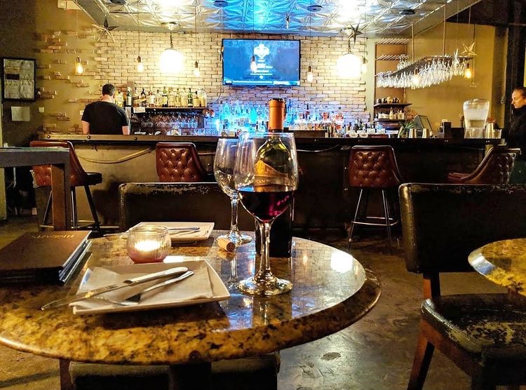 Main bar area with wine glass and bottle